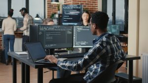 Developer writing Magento code in an office