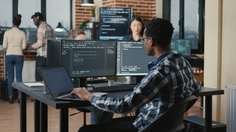 Developer writing Magento code in an office