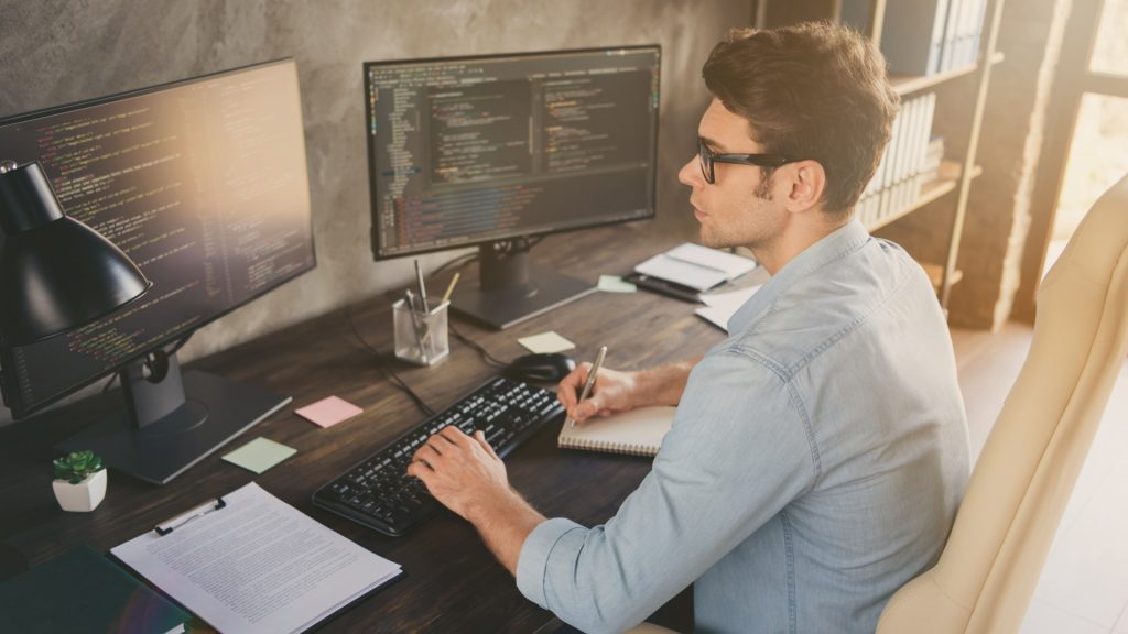 Magento developer working on two monitors